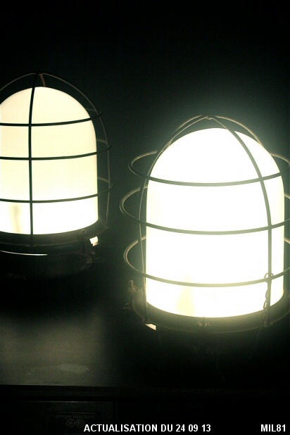 Luminaires de balisage en verre opale, d'origine marine, vers 1930, entirement tanches, pattes de fixations, acier brut.